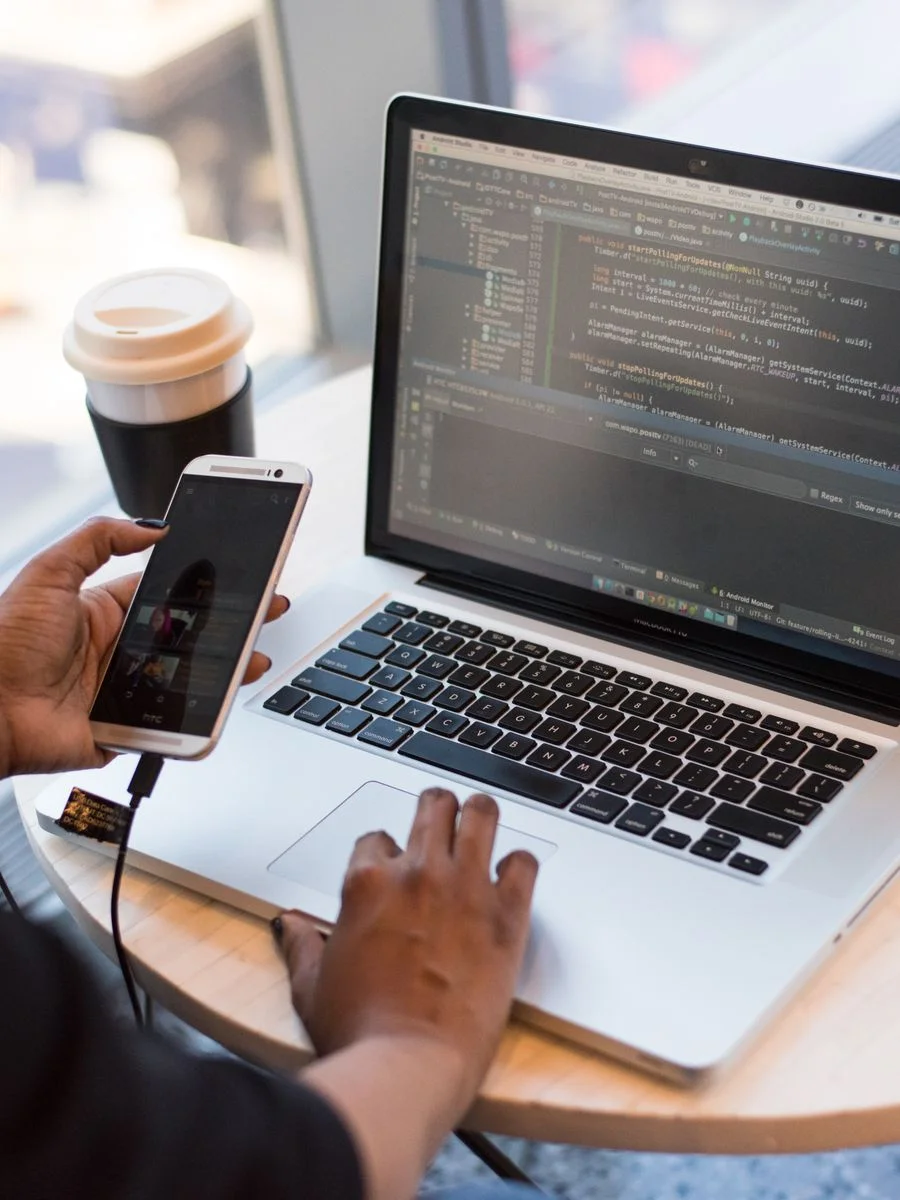 Laptop with code for web development insights blog
