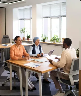 Trusted diverse team aligning on client requirements with data insights